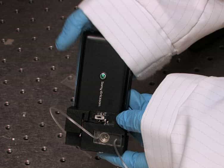 Wide-field Fluorescent Microscopy and Fluorescent Imaging Flow Cytometry on a Cell-phone