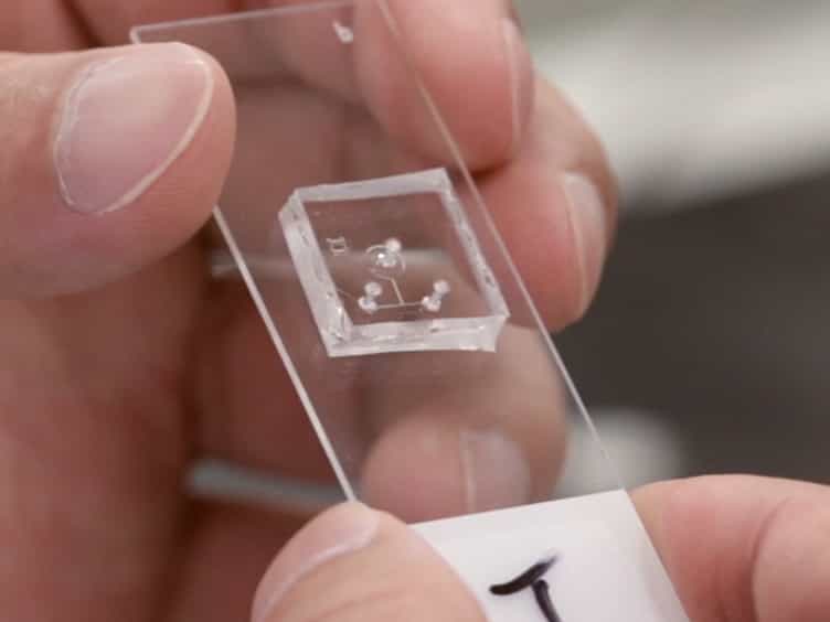 Analyzing Mixing Inhomogeneity in a Microfluidic Device by Microscale Schlieren Technique