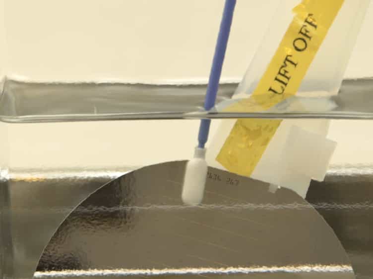 Fabrication of Low Temperature Carbon Nanotube Vertical Interconnects Compatible with Semiconductor Technology