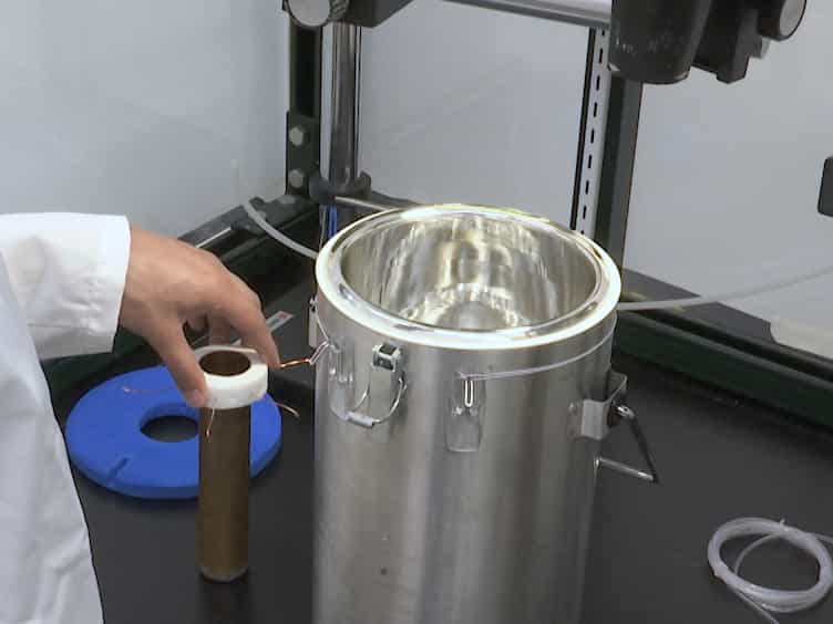 Measuring the Densities of Aqueous Glasses at Cryogenic Temperatures