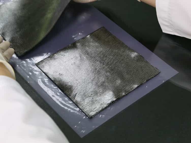 Experimental Implementation of a New Composite Fabrication Method: Exposing Bare Fibers on the Composite Surface by the Soft Layer Method