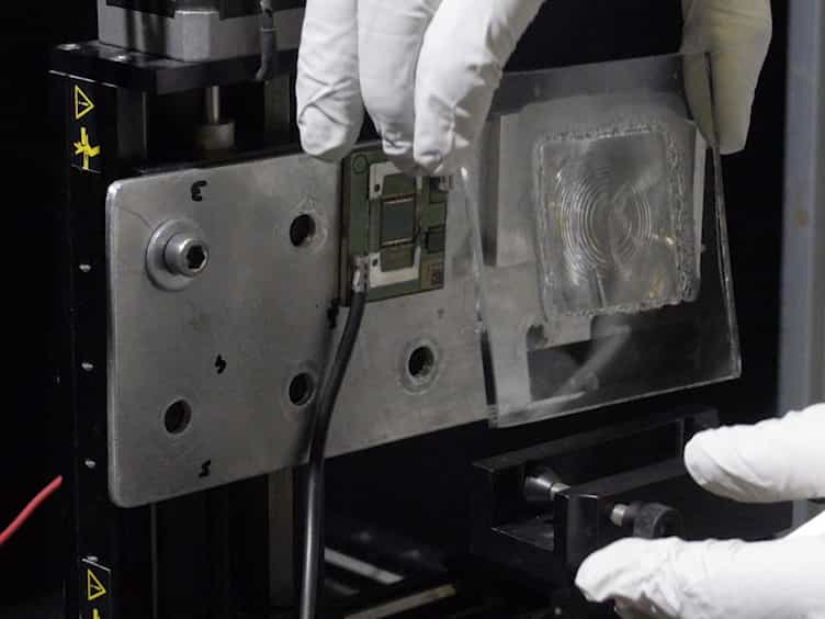 Indoor Experimental Assessment of the Efficiency and Irradiance Spot of the Achromatic Doublet on Glass ADG Fresnel Lens for Concentrating Photovoltaics