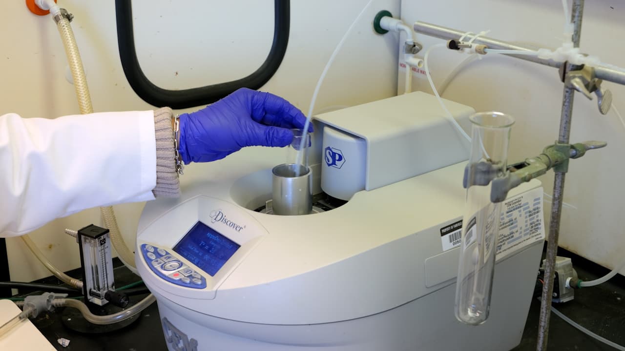An Inexpensive Adaptation of a Commercial Microwave Reactor for Solid Phase Peptide Synthesis