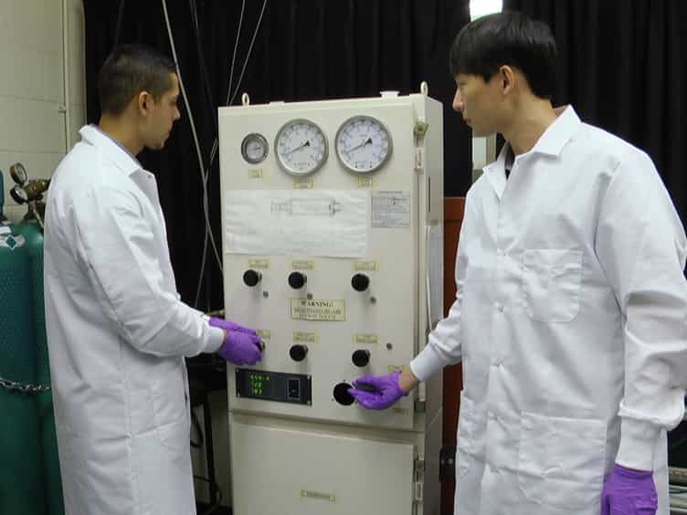 Conducting Elevated Temperature Normal and Combined Pressure-Shear Plate Impact Experiments Via a Breech-end Sabot Heater System