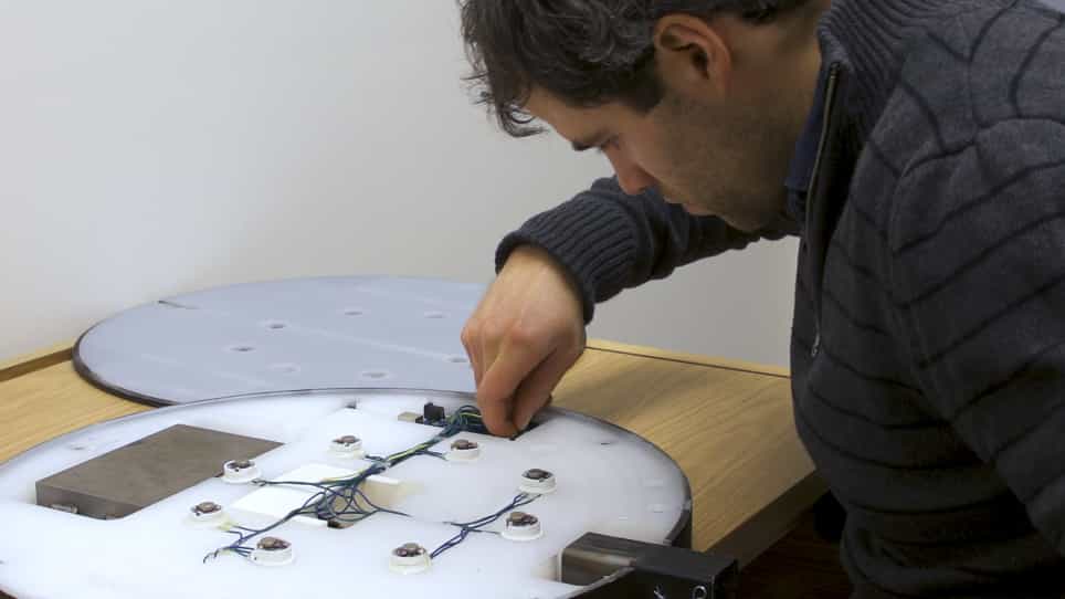 A Vibrotactile Feedback Device for Seated Balance Assessment and Training